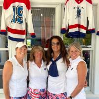 Four alums in USA themed skirts.